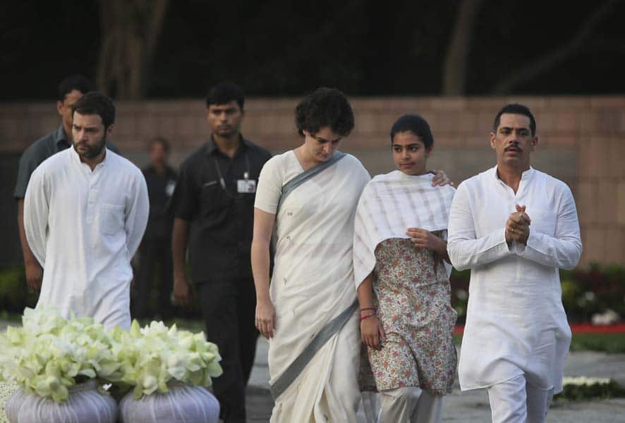 India’s Congress Party President Sonia Gandhi`s daughter Priyanka Vadra, center, accompanied by her daughter Miraya Vadra, second right and husband Robert Vadra, right, pays tributes to former Indian Prime Minister Rajiv Gandhi on his birth anniversary at his memorial in New Delhi.