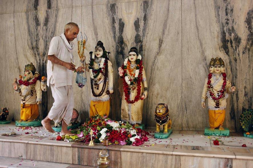 A Hindu priest offers prayers at a Lord Shiva temple on “Shravan Somwar” in Allahabad. Shravan Somwar or the Monday of Hindu calendar month is considered auspicious for offering prayer to Lord Shiva, the god of destruction.