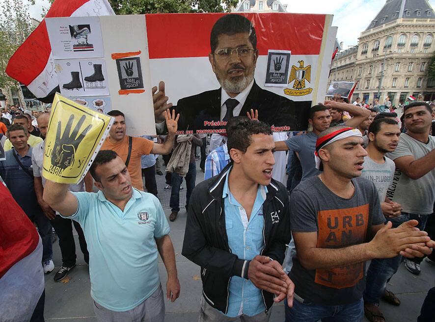 Egyptian supporters of ousted Egyptian President Mohammed Morsi living in France, protest in Paris.