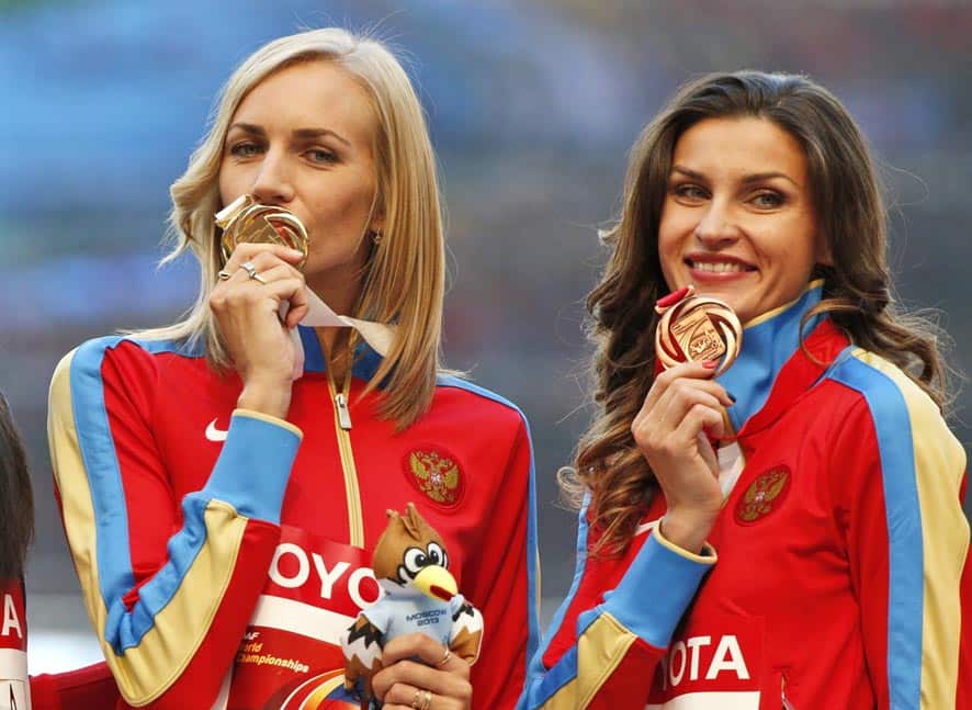 Russia`s Svetlana Shkolina, left, and Russia`s Anna Chicherova pose with their medals on the podium for the women`s high jump at the World Athletics Championships in the Luzhniki stadium in Moscow, Russia.