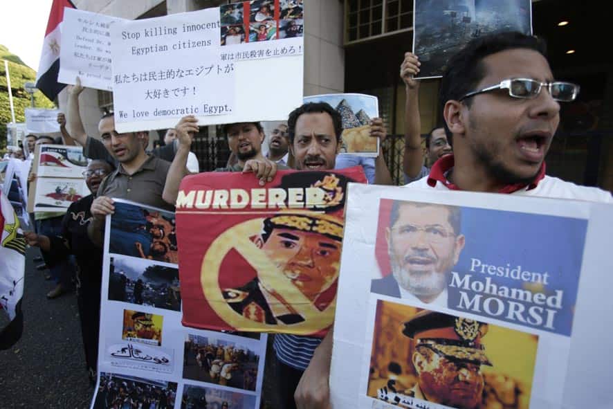 Egyptians living in Japan shout slogans during a demonstration in front of Egypt Embassy in Tokyo.