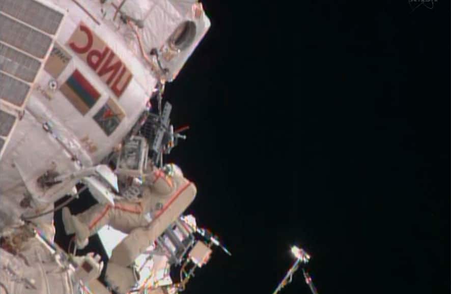 In this image from video made available by NASA, cosmonaut Fyodor Yurchikhin approaches a hatch on the International Space Station, about 7 hours into a spacewalk with Aleksandr Misurkin.