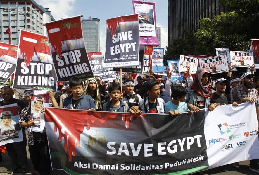 Indonesian Muslims stage a rally calling for an end to the violence used against the supporters of ousted President Mohammed Morsi in Egypt, in Jakarta, Indonesia.