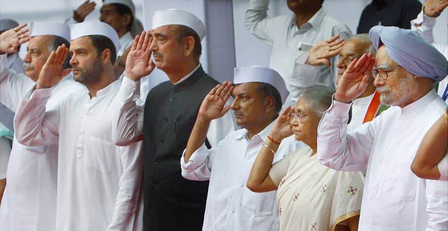 Prime Minister Manmohan Singh and others, from second right, Delhi state Chief Minister Sheila Dikshit, Defense Minister A.K. Antony, Health Minister Ghulam Nabi Azad and Congress party Vice President Rahul Gandhi, salute during a flag hoisting ceremony at the Congress party headquarters to mark Independence Day in New Delhi.