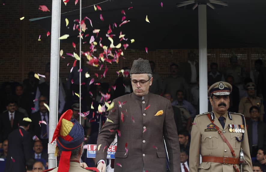 Jammu and Kashmir State Chief Minister Omar Abdullah hoists an Indian flag during India`s Independence Day celebrations in Srinagar.