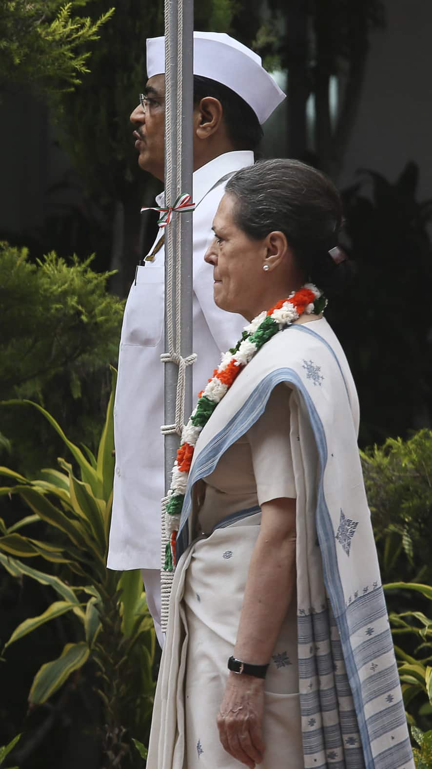 Congress Party President Sonia Gandhi stands at attention before hoisting the national flag at the party headquarters to mark Independence Day in New Delhi.