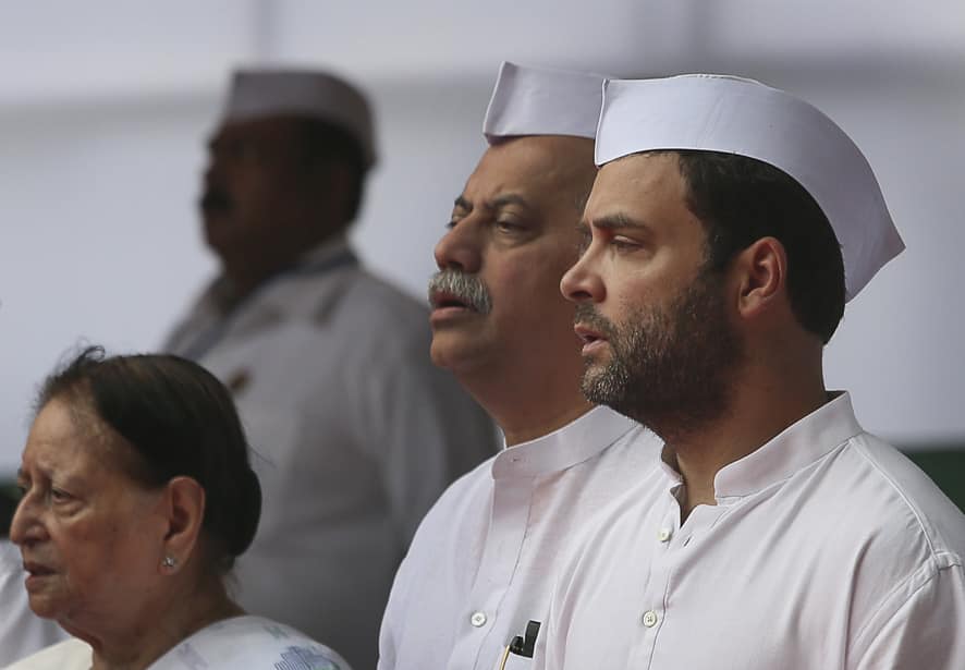 Congress party Vice president Rahul Gandhi sings the national anthem with other party leaders during a flag hoisting ceremony at the party headquarters to mark Independence Day in New Delhi.