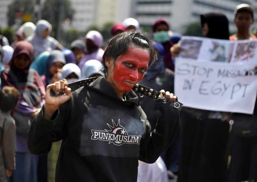 An Indonesian Muslim man with painted face takes part in a rally calling for an end to the violence used against supporters of ousted President Mohammed Morsi in Egypt, in Jakarta, Indonesia.