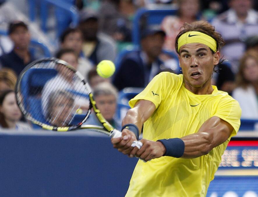 Rafael Nadal, from Spain, returns a shot from Benjamin Becker, from Germany, during a match at the Western & Southern Open tennis tournament in Mason, Ohio.