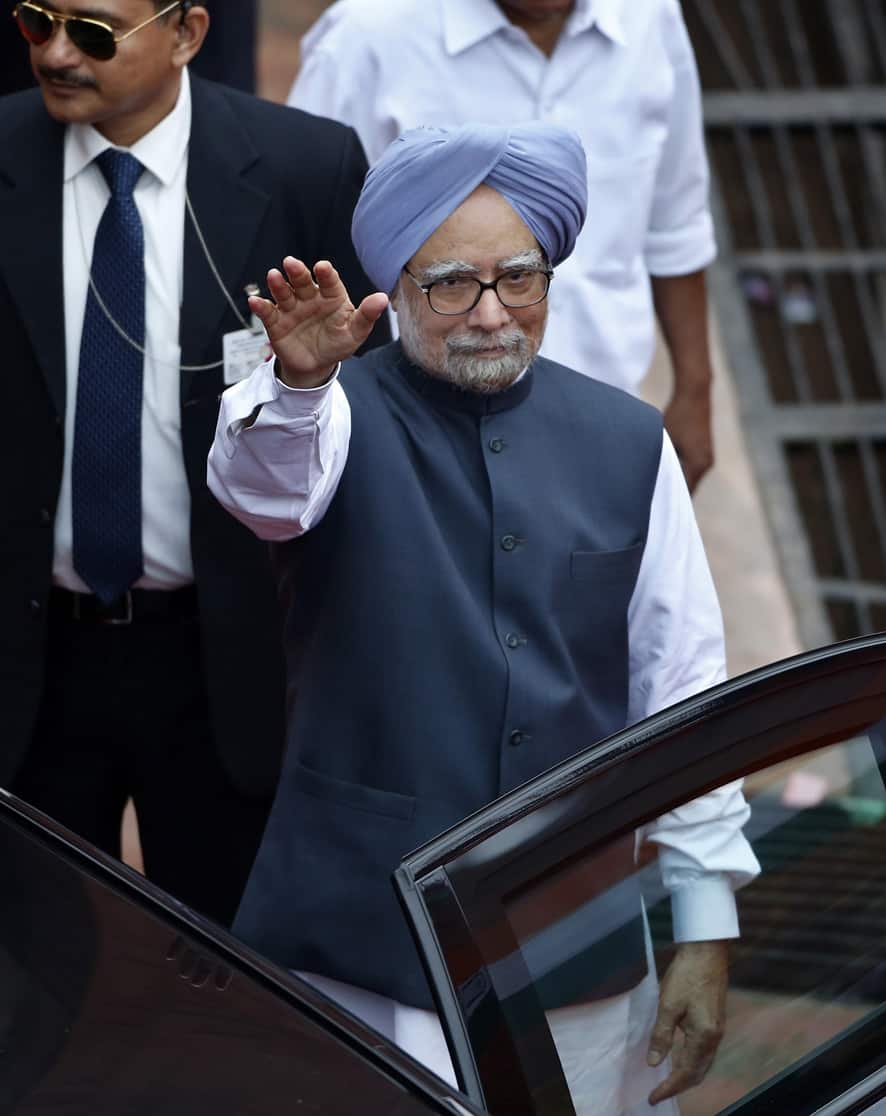 Prime Minister Manmohan Singh, waves before leaving the Red Fort after addressing the nation to celebrate India`s Independence Day, in New Delhi.