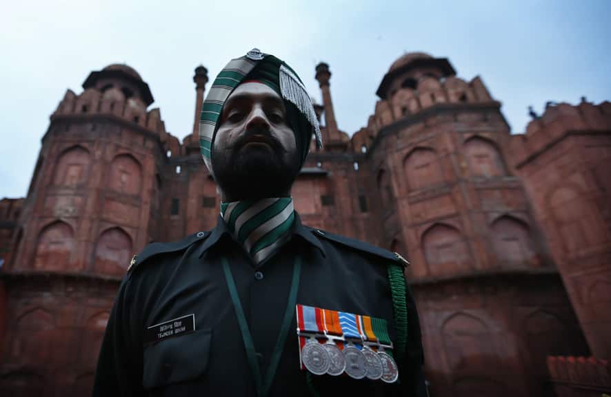 An Indian soldier stands guard at the Red Fort before Indian Prime Minister Manmohan Singh arrives to address the nation on Independence Day, in New Delhi.