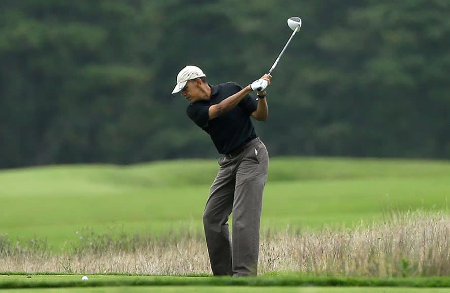 President Barack Obama golfs at Vineyard Golf Club in Edgartown, Mass., on the island of Martha`s Vineyard.