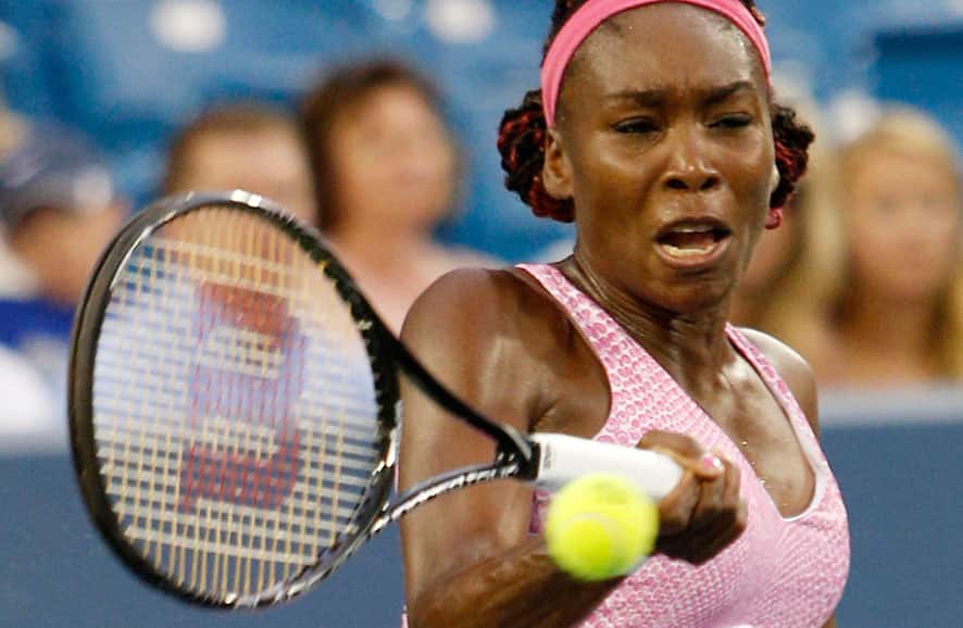 Venus Williams, from the United States, returns to Jana Cepelova, from Slovakia, during a match at the Western & Southern Open tennis tournament in Mason, Ohio.