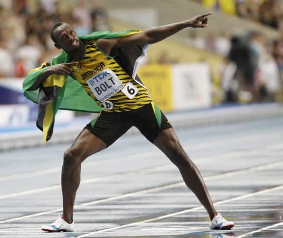 Jamaica`s Usain Bolt celebrates winning gold in the Men`s 100-meter final at the World Athletics Championships in the Luzhniki stadium in Moscow, Russia.