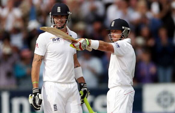 England`s Ian Bell, right, celebrates after scoring 50 with Kevin Pietersen, left, during the third day of the fourth Ashes series cricket match against Australia at the Riverside cricket ground, Chester-le-Street, England.