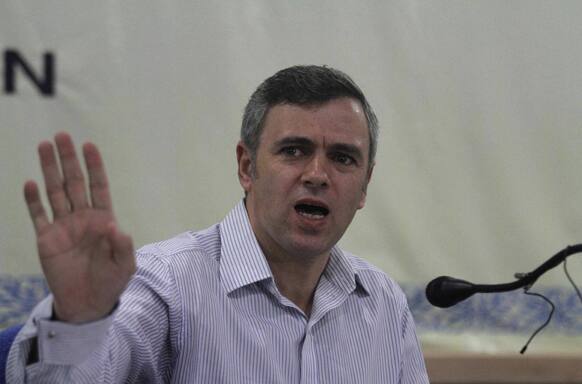 Jammu and Kashmir state Chief Minister Omar Abdullah gestures as he addresses a press conference in Srinagar.