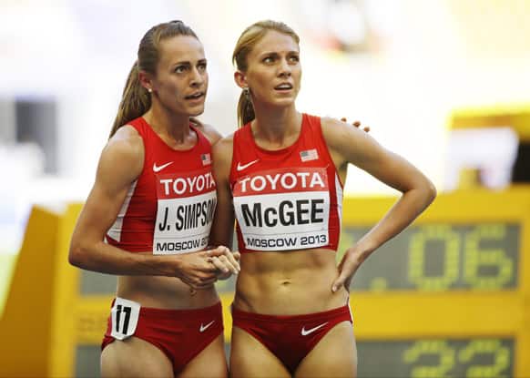United States` Jennifer Simpson, left, and United States` Cory Mcgee look at the timing board after a women`s 1500-meter heat at the World Athletics Championships in the Luzhniki stadium in Moscow.
