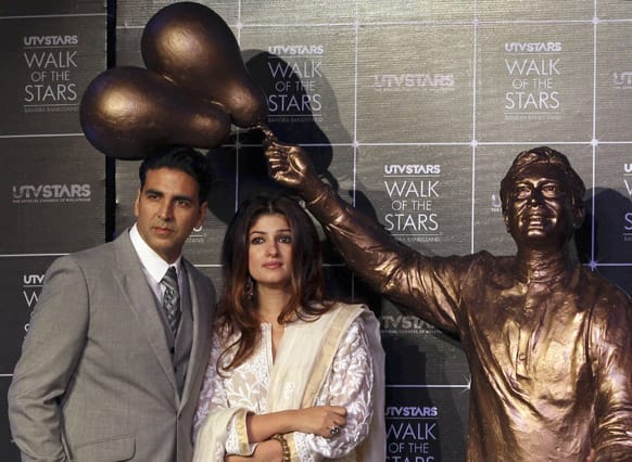Former Bollywood actress Twinkle Khanna and her husband Akshay Kumar attend the unveiling of a statue of her father and Bollywood superstar Rajesh Khanna in Mumbai.