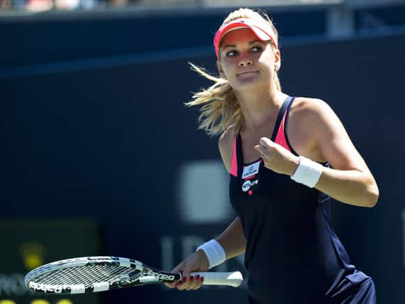 Agnieszka Radwanska of Poland reacts after defeating Sara Errani of Italy during the quarter final of the Rogers Cup women`s tennis tournament, in Toronto.