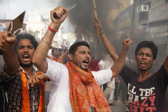 Indian Hindu protestors shout slogans against the state government after rival communities clashed in Kishtwar.