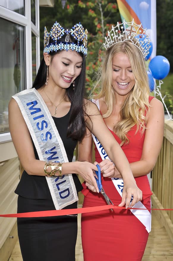 Miss World, Yu Wenxia of China and Miss England, Kirsty Heslewood cut a ribbon to officially open a new holiday home caravan at the Finlake Holiday Park, south west England.