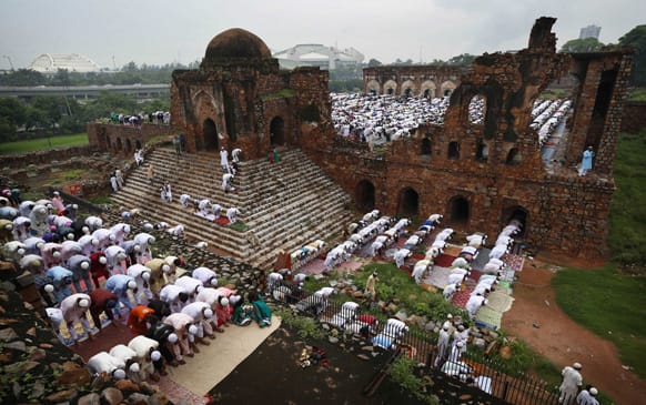 Muslims offer prayers on the occasion of Eid al-Fitr in the ruins of the Feroz Shah Kotla Mosque in New Delhi.