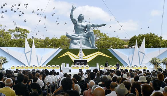 Doves fly during a ceremony to mark the 68th anniversary of the world`s second atomic bomb attack over the city, at Nagasaki Peace Park in Nagasaki, southern Japan.