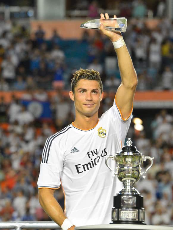 Real Madrid forward Cristiano Ronaldo receives the MVP award after beating Chelsea during the championship match during the Guinness International Champions at Sun Life Stadium in Miami Gardens, Florida.