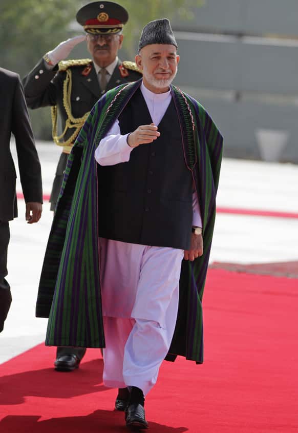 Afghan President Hamid Karzai arrives for Eid al-Fitr prayer that marks the end of the Muslim holy month of Ramadan in Kabul.