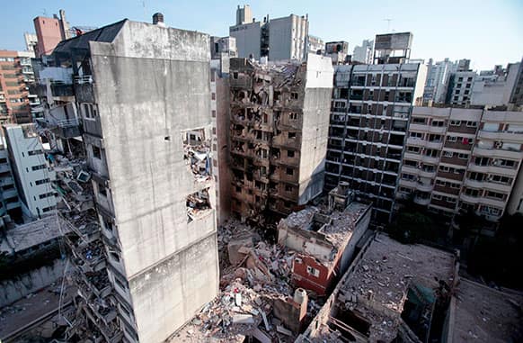 This view shows two other towers, in front of and behind a 10-story apartment building destroyed by a Tuesday gas explosion that killed 10 people, in Rosario, Argentina.