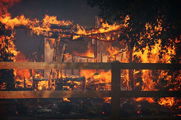 Multiple structures burn in the Poppet Flats area as the Silver Fire roared through the area along Hwy 243 between Banning and Idyllwild, Calif.