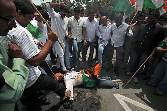 Activists of All India Youth Congress burn an effigy of Pakistan’s spy service, Inter Services Intelligence (ISI) during a protest against the death of five Indian army soldiers in cross-border exchanges, in Hyderabad.