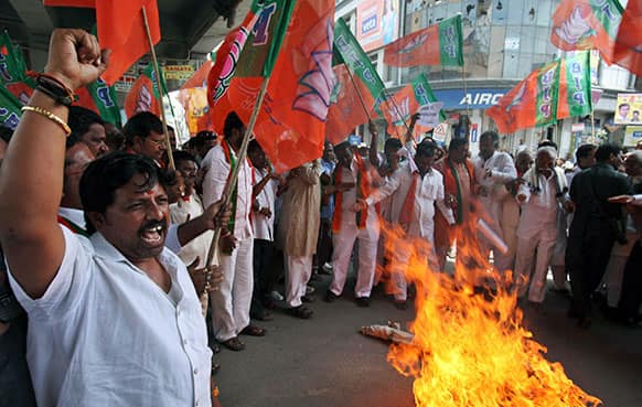 Activists of All India Youth Congress burn an effigy of Pakistan’s spy service, Inter Services Intelligence (ISI) during a protest against the death of five Indian army soldiers in cross-border exchanges, in Hyderabad.