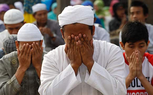 Muslims offer Eid al-Fitr prayers that marks the end of the holy fasting month of Ramadan in Jakarta, Indonesia.