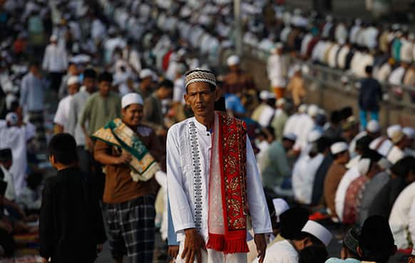 A man walks after Eid al-Fitr prayers that marks the end of the holy fasting month of Ramadan in Jakarta, Indonesia.