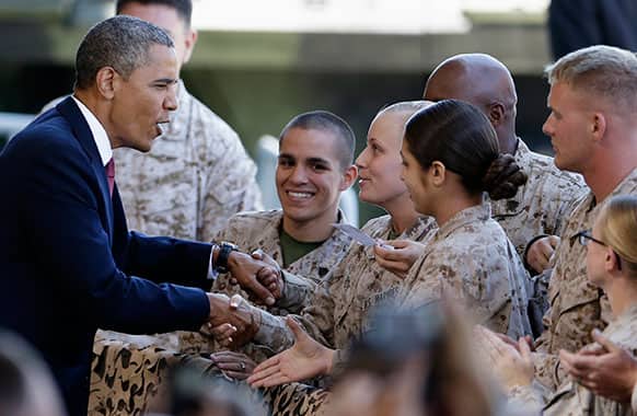 President Barack Obama greets Marines and their families before a speech in Camp Pendleton, Calif. The visit to the Marine Corps base is Obama`s final stop on a two-day West Coast trip that included the rollout of his principles for overhauling the nation`s mortgage finance industry.
