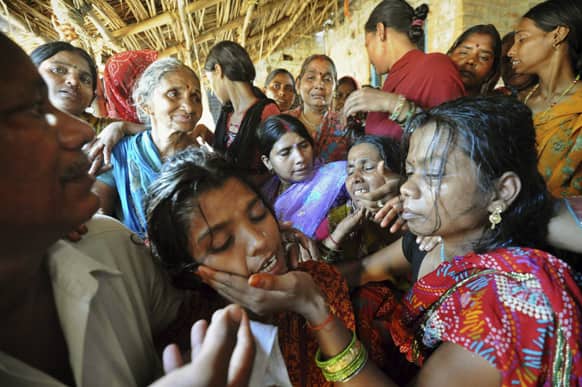 Family members mourn the death of Indian army soldier Vijay Kumar Rai in their village in Bihta in rural Patna.