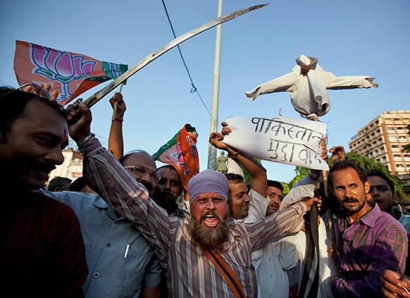 Bharatiya Janata Party activists shout slogans during a protest against the death of five Indian army soldiers in cross-border exchanges, in Allahabad.