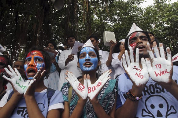 Students with painted faces participate in a Hiroshima Day peace rally in Mumbai. Tuesday marked the 68th anniversary of the world`s first atomic bomb attack that killed as many as 140,000 people.