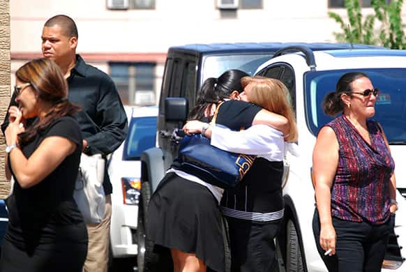 Mourners embrace after the funeral for Angelie Paredes at Vainieri funeral home in North Bergen, N.J. Paredes was killed last week when an out-of-control bus knocked over a light pole, which then fell into her stroller.