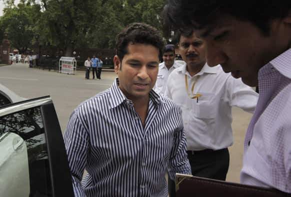 Cricketer and members of parliament Sachin Tendulkar, arrives at the parliament house on the opening day of monsoon session, in New Delhi.