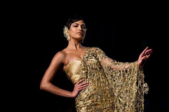 A model displays a creation by designer Gaurav Gupta during the Delhi Couture Week in New Delhi.