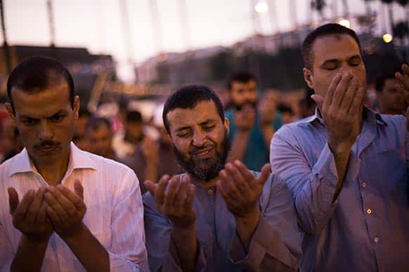 Supporters of Egypt`s ousted President Mohammed Morsi pray after