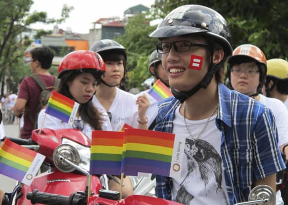 A gay rights supporter prepares for gay parade in Hanoi, Vietnam. About 400 hundred people rode bicycles and motorbikes through Hanoi capital streets to raise awareness of gay rights and call for legalization of same sex marriage.