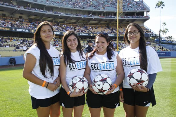 Ball girls stand on the field at the Guinness International Champions Cup soccer match featuring Real Madrid vs. Everton at Dodger Stadium, in Los Angeles, California.