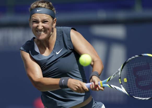 Victoria Azarenka, of Belarus, returns a serve from Ana Ivanovic, of Serbia, during their semifinal match of the Southern California Open tennis tournament.