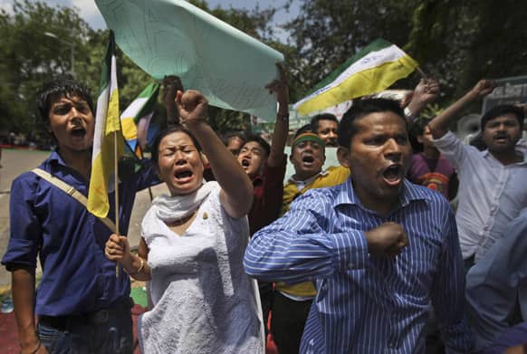 Members of Gorkha Janamukti Morcha (GJM) shout slogans during a protest to demand their own separate state of Gorkhaland, in New Delhi.
