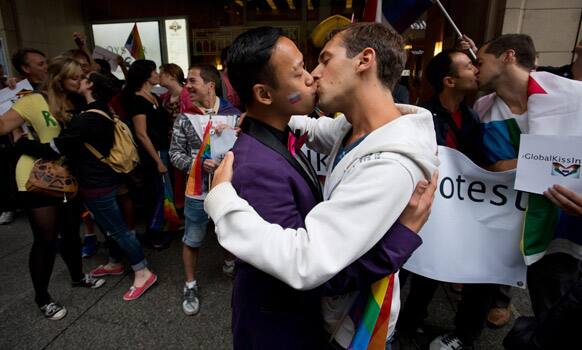 People take part in a Kiss-in protest outside Russian Consulate in protest of anti-gay laws in Russia, in Vancouver, British Columbia.