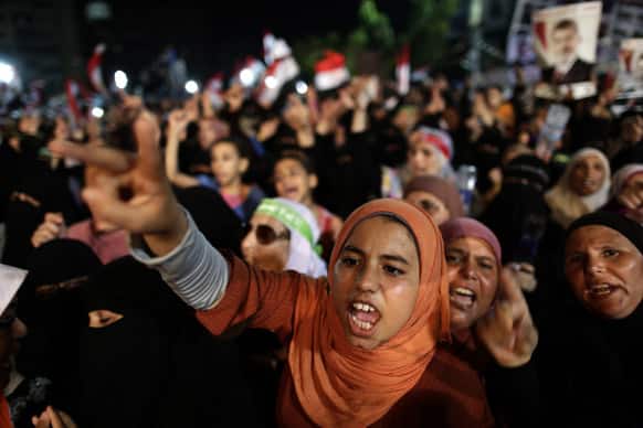 Supporters of Egypt`s ousted President Mohammed Morsi chant slogans against Egyptian Defense Minister Gen. Abdel-Fattah el-Sissi outside Rabaah al-Adawiya mosque, where supporters of Egypt`s ousted President Mohammed Morsi have installed a camp and hold daily rallies at Nasr City, in Cairo.