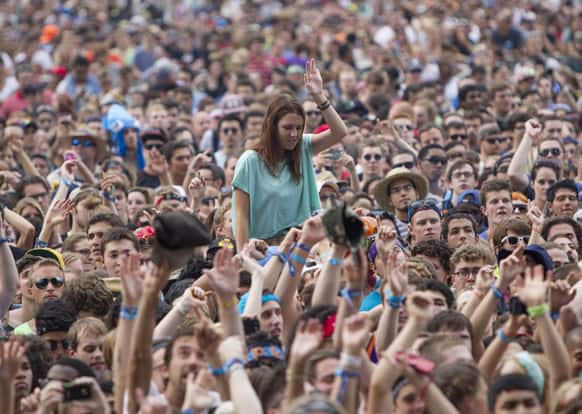 Fans watch Canadian electronic band Crystal Castles perform at Lollapalooza Festival in Chicago. The more than two-decade-old festival opens Friday in Chicago`s lakefront Grant Park.